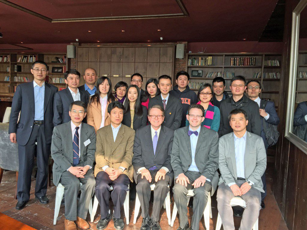 Dean Bruner, Dennis Yang, and Marc Johnson meet with Darden alumni in Shanghai at a Darden Society event. 