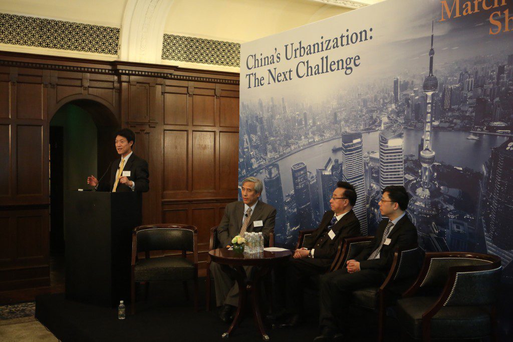 Dennis Yang leads the Urbanization panel discussion on business and economics development . 