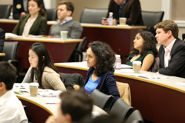 Darden students listen to speakers at the Darden Global Conference. 