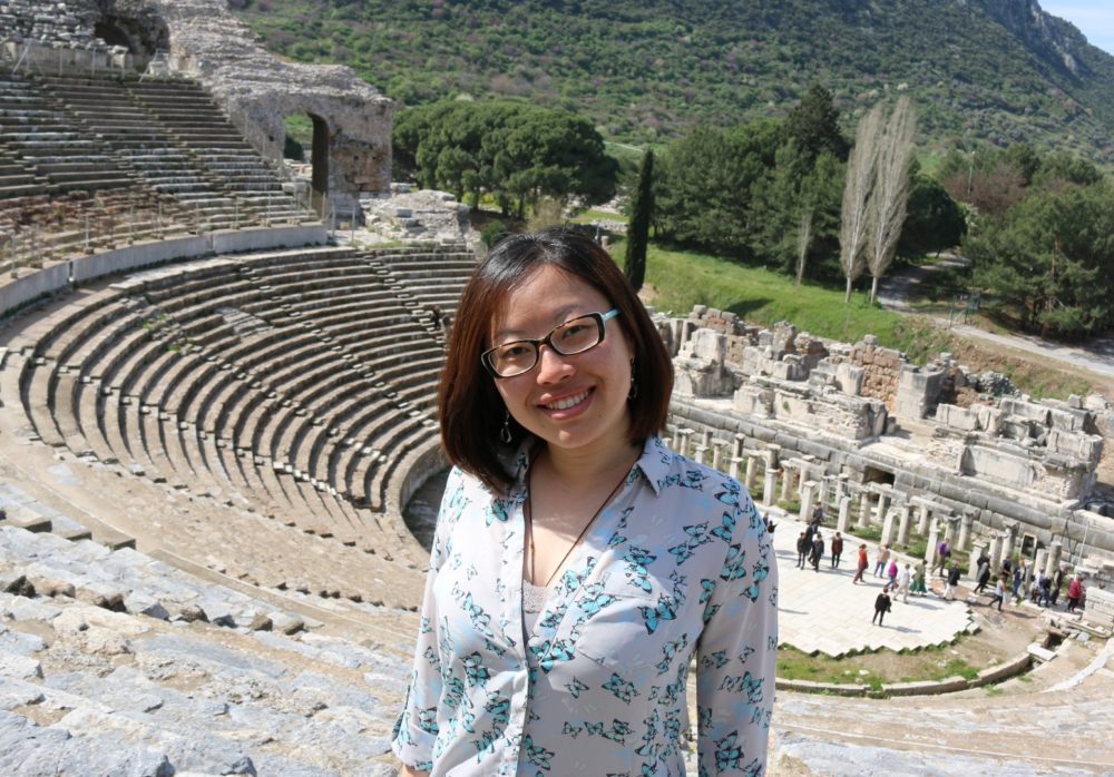 Helen Yao standing in front of a historical site