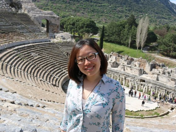Helen Yao standing in front of a historical site