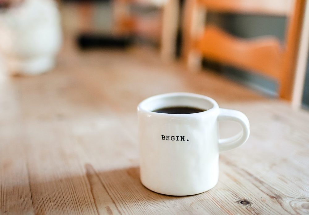 A mug with coffee on a table