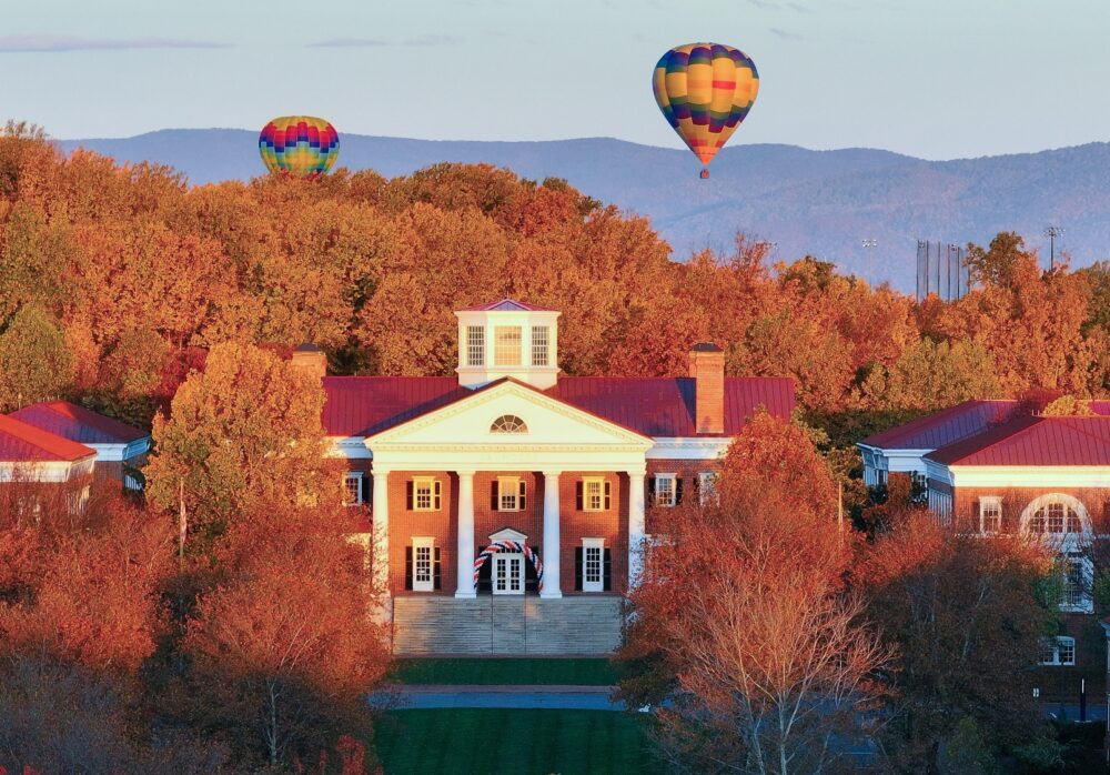 UVA Darden fall season with mountains and hot air balloon in background