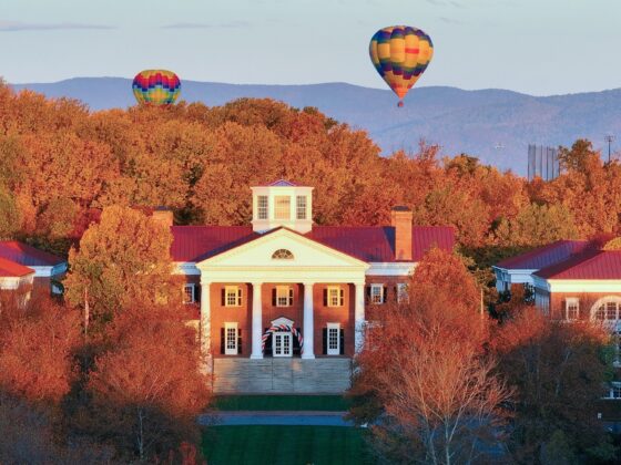 UVA Darden fall season with mountains and hot air balloon in background