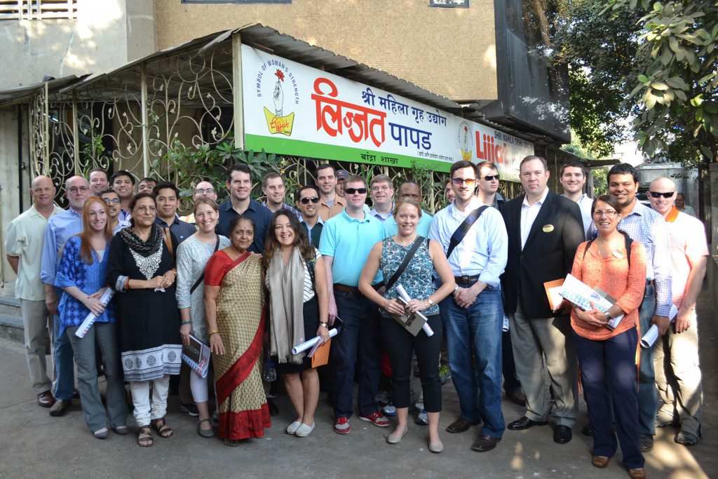 GEMBA students and faculty stand outside of Lijjat Papad where they learned about XXXX. 