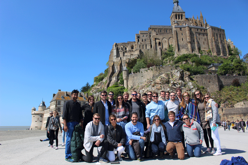 Normandy Leadership Ride students gather in front of Mont Saint Michel. 